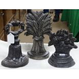 3 Cast-iron doorstops.