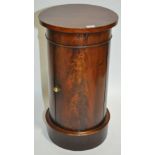 A Victorian mahogany drum shaped bedside cupboard.