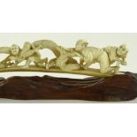 A Japanese Meiji period ivory carving depicting fi