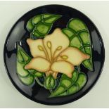 A Moorcroft floral pattern pin dish, 1999, diamete