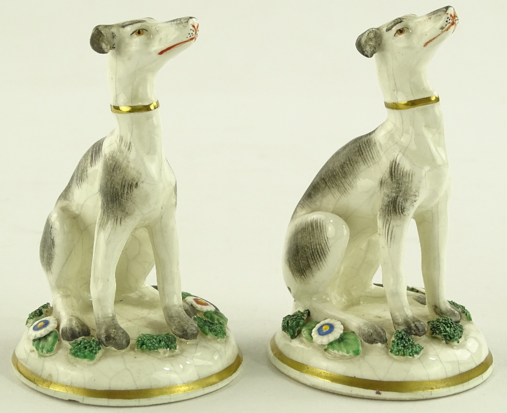 A pair of Samson porcelain seated dogs, gold ancho