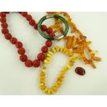 A string of cinnabar beads, 2 strings of amber bea