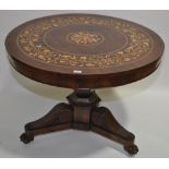 An ornate 19th century circular mahogany drum top