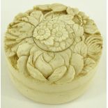 A Japanese Meiji period circular ivory box, relief