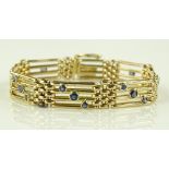 A 9ct gold gate-link bracelet set with 18 sapphire