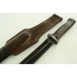 An early 20th century bayonet, metal scabbard with