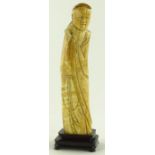 A 17th century carved ivory figure of a monk, with