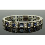 A blue and white sapphire set line bracelet circa