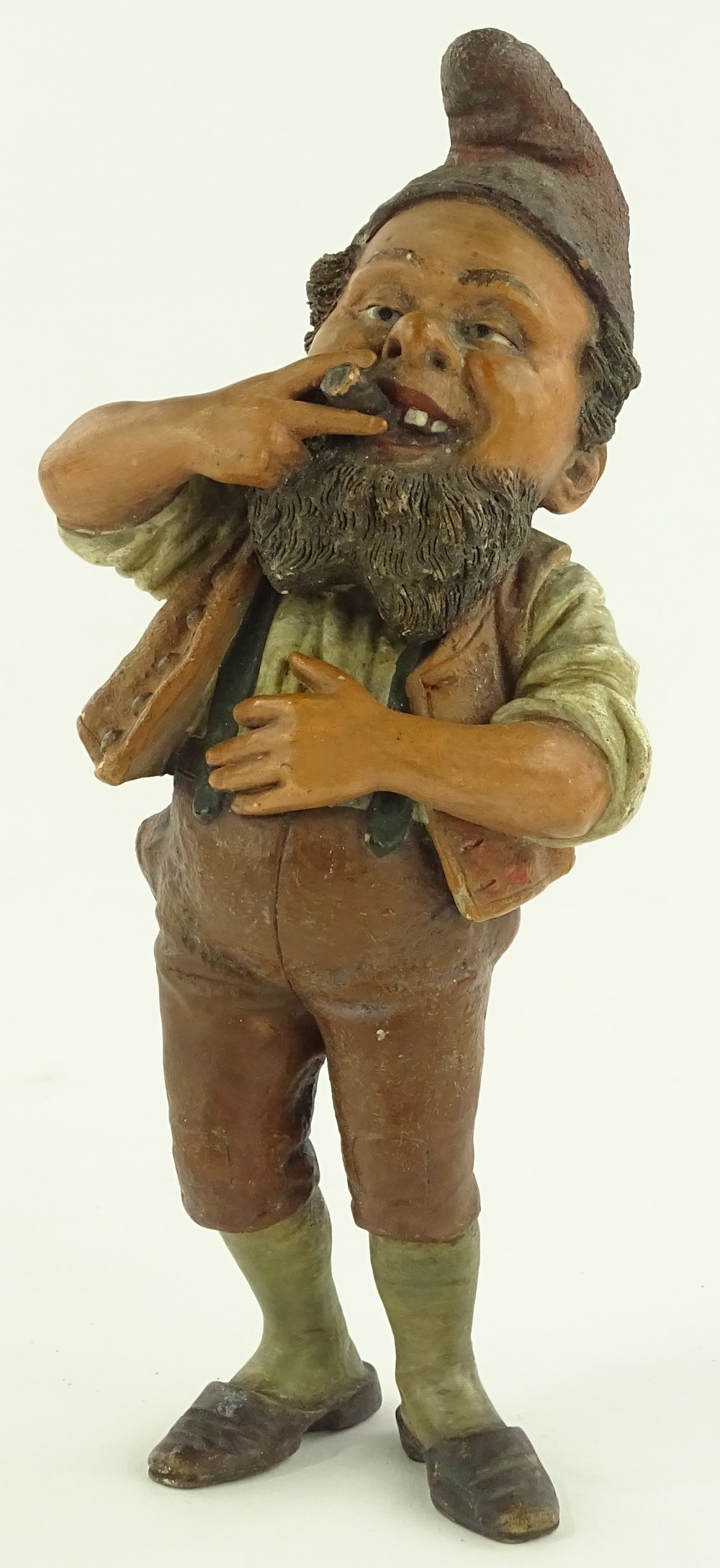 A 19th century painted terracotta dwarf smoking a