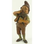 A 19th century painted terracotta dwarf smoking a