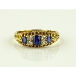 An Edwardian 18ct gold 7 stone sapphire and diamon