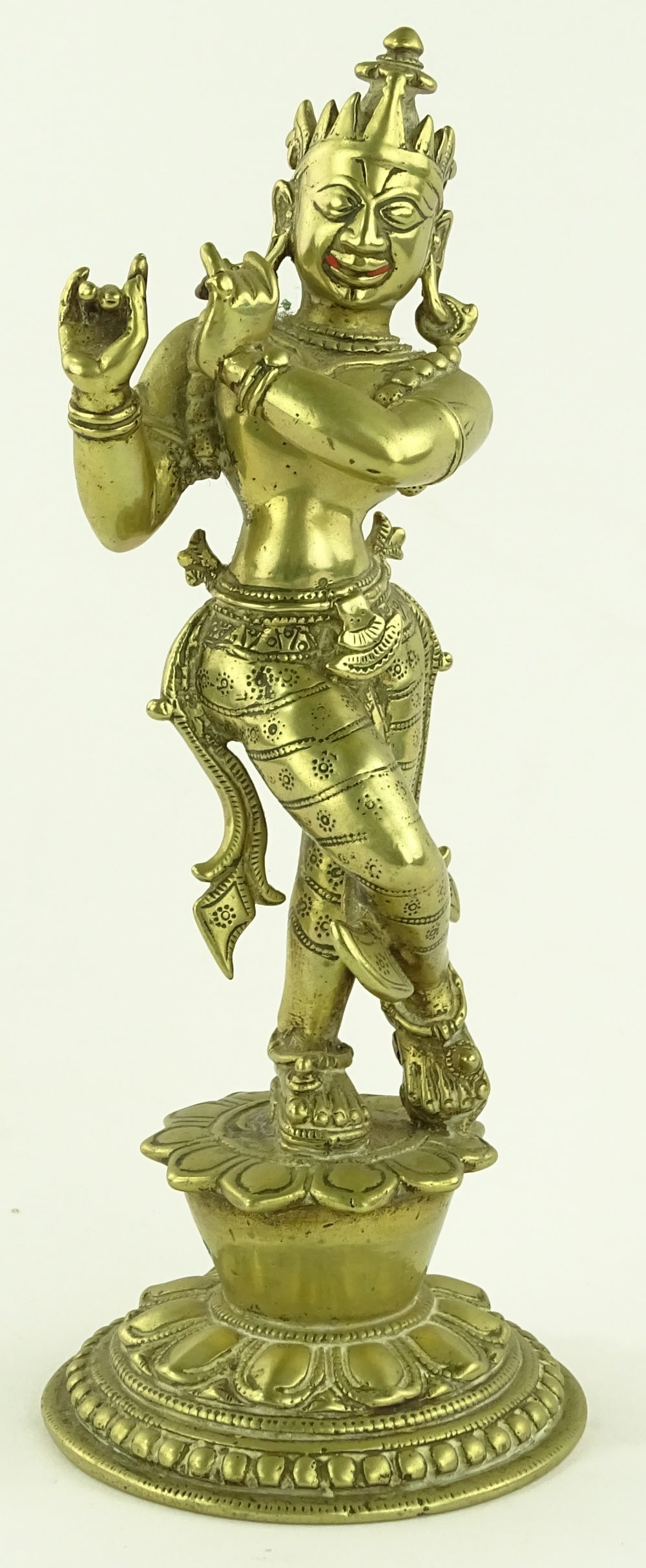 An Antique Oriental bronze dancing deity, height 2