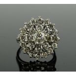 A large 18ct white gold diamond cluster ring, cent