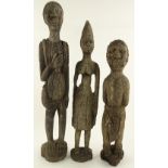 An African carved hardwood figure of a slave with