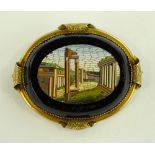 A Victorian micro-mosaic brooch depicting Roman ru