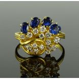 An 18ct gold sapphire and diamond set cocktail rin