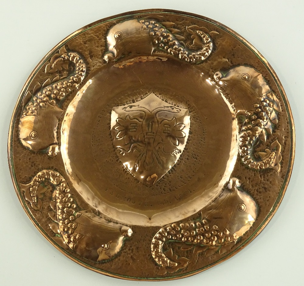 A Newlyn Arts & Crafts copper charger, relief embo