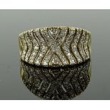 A 9ct gold diamond set dress ring, setting height