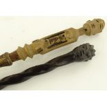2 African carved wood tribal staffs.