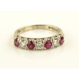 An 18ct gold 7 stone ruby and diamond ring, settin