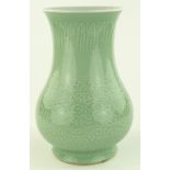 A Chinese Celedon porcelain vase, relief embossed