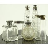 A group of silver topped toilet jars and perfume b