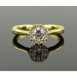 A modern 18ct gold diamond cluster ring, setting 7