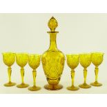 An amber cut-glass decanter and 6 matching glasses