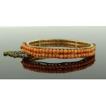 A Victorian double row coral hinged bangle, gilt m