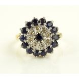 An 18ct gold sapphire and diamond set cluster ring