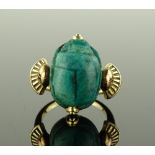 An Egyptian style unmarked gold and scarab mounted