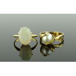A 9ct gold and whole pearl ring, and a white opal