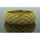 A fine quality 18ct gold woven mesh bracelet, rais