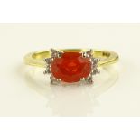 An 18ct gold fire opal and diamond set cluster rin