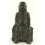 An Antique Japanese patinated bronze seated Buddha