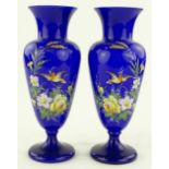 A pair of Victorian blue overlay glass vases with