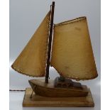 A 1950s wooden sailing boat design table lamp with