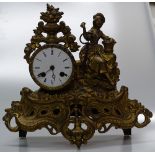 A continental ornate gilt metal clock with 2-train