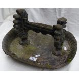 A large Victorian cast-iron boot scraper and a tab