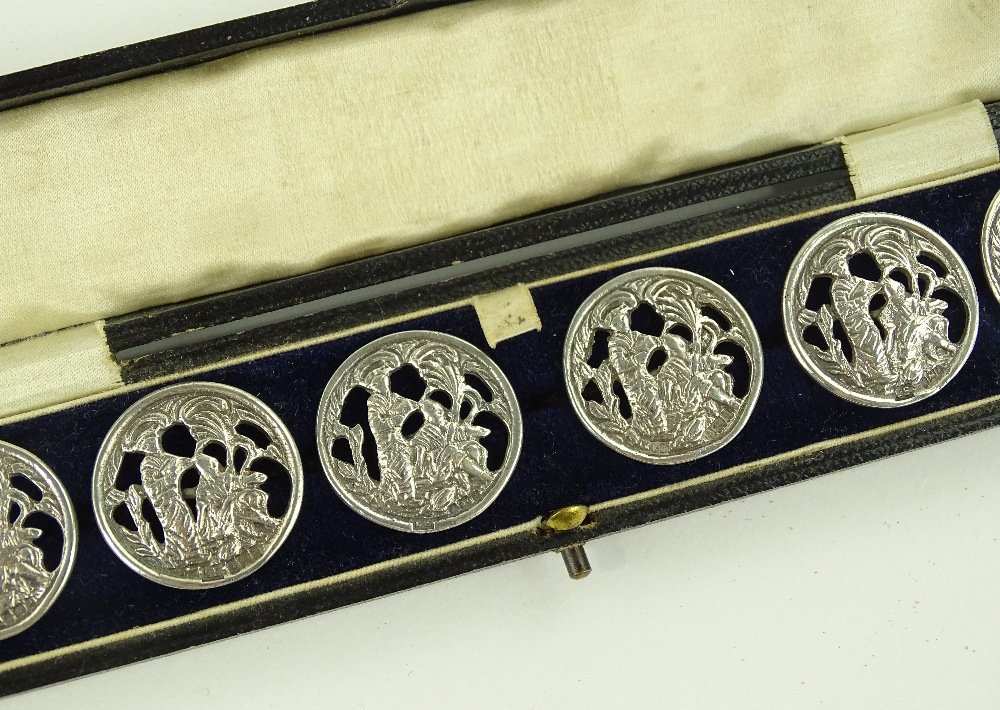 A cased set of 6 silver buttons, by Laurence Emanu