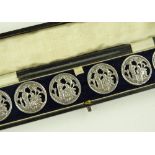 A cased set of 6 silver buttons, by Laurence Emanu