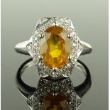 A 14ct white gold yellow sapphire and diamond set