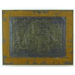 A 19th century Oriental relief embossed copper pla
