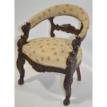 A 19th century carved oak framed bow back armchair