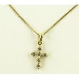 An 18ct gold diamond set cross pendant on 9ct chai