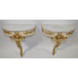 A pair of modern carved, painted and gilded wood c
