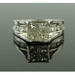 An 18ct white gold Princess-cut diamond dress ring