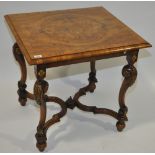 An early 20th century carved walnut and parcel gil