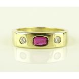 A heavy 14ct gold 3 stone ruby and diamond set rin