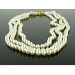 An 18"" 3 row cultured pearl necklace on 18ct gold